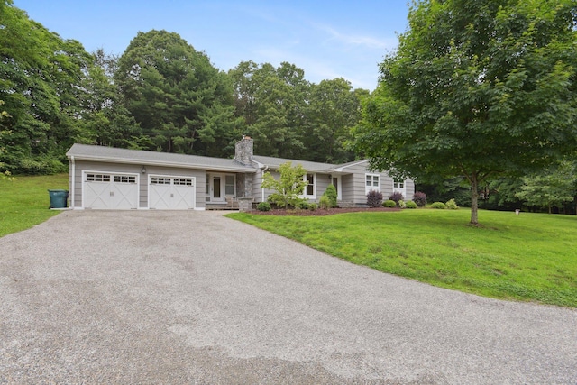 40 Chestnut Ln, Hamden, CT 06518 - ranch-style house with a chimney, a front lawn, driveway, and a garage