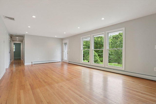 40 Chestnut Ln, Hamden, CT 06518 - empty room with baseboard heating, recessed lighting, and light wood-type flooring