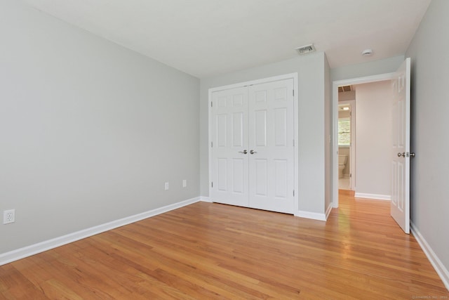 40 Chestnut Ln, Hamden, CT 06518 - unfurnished bedroom featuring light wood-style flooring and a closet