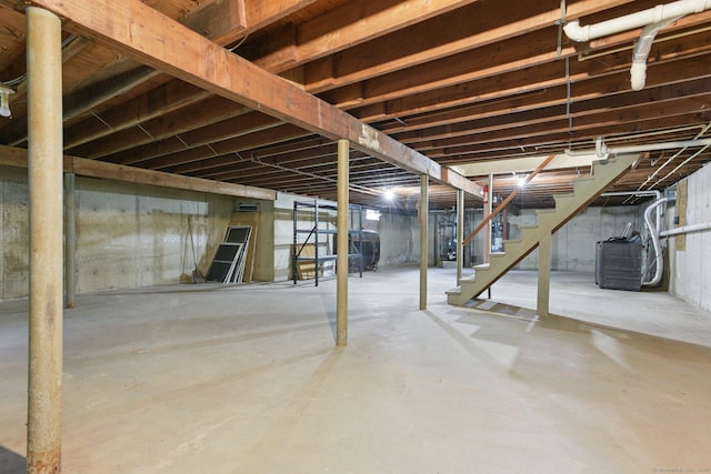 40 Chestnut Ln, Hamden, CT 06518 - unfinished basement featuring stairs, oil tank, and a heating unit