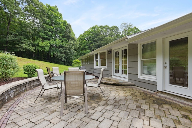 40 Chestnut Ln, Hamden, CT 06518 - view of patio / terrace with french doors, outdoor dining area, and view of scattered trees