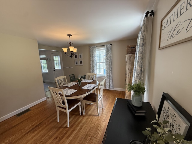 104 Wildcat Hill Rd, Harwinton, CT 06791 - dining area with a chandelier, plenty of natural light, and wood finished floors