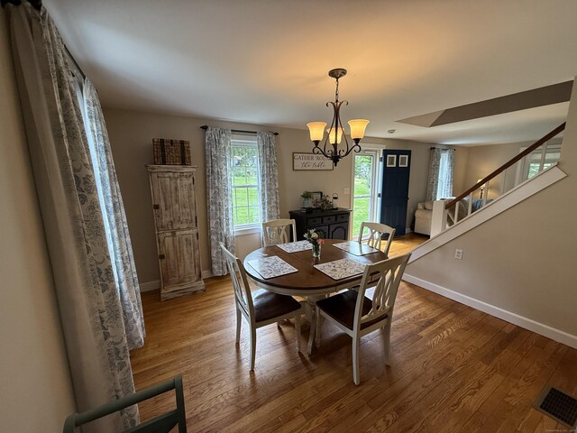 104 Wildcat Hill Rd, Harwinton, CT 06791 - dining area featuring stairway, a chandelier, and wood finished floors