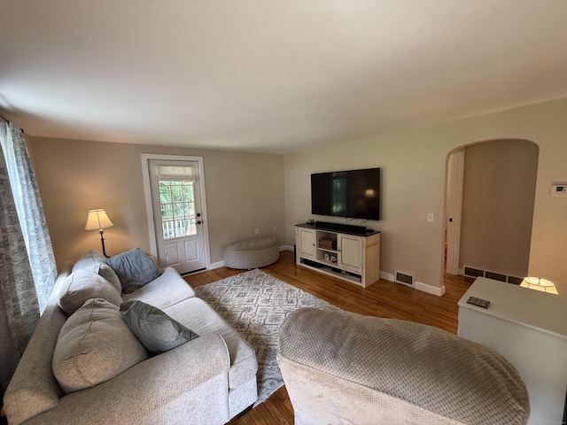 104 Wildcat Hill Rd, Harwinton, CT 06791 - living area with arched walkways and wood finished floors
