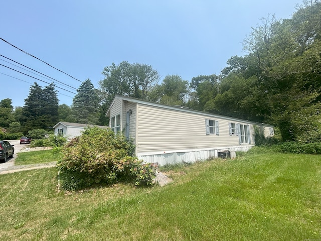 967 Long Cove Rd Trlr 2, Ledyard, CT 06335 - view of side of home with a central air condition unit and a lawn