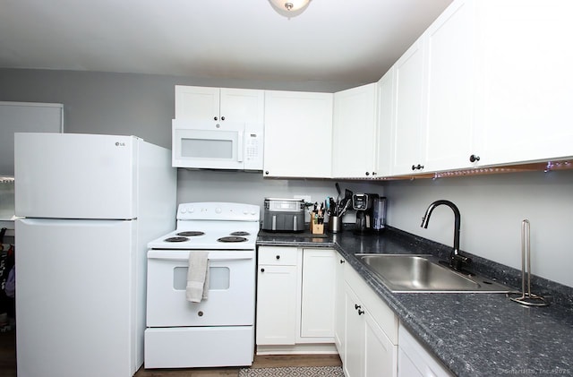28 Chester Ln, Wallingford, CT 06492 - kitchen with white appliances, white cabinets, and dark stone counters