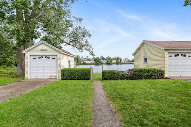 96 Kenwood Ave, Fairfield, CT 06824 - view of yard featuring a water view, an outdoor structure, and concrete driveway