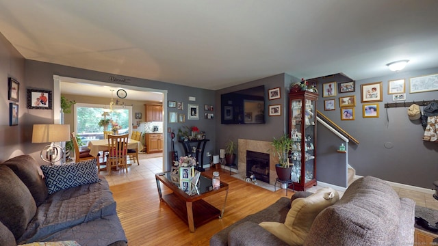 345 Goodwin St, East Hartford, CT 06108 - living room featuring a high end fireplace and light wood-style floors