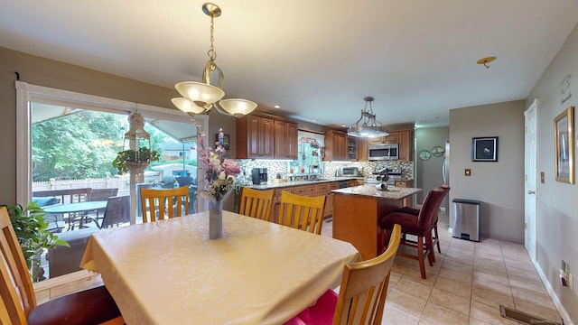 345 Goodwin St, East Hartford, CT 06108 - dining area featuring light tile patterned floors