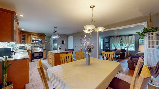 345 Goodwin St, East Hartford, CT 06108 - dining space featuring light tile patterned floors