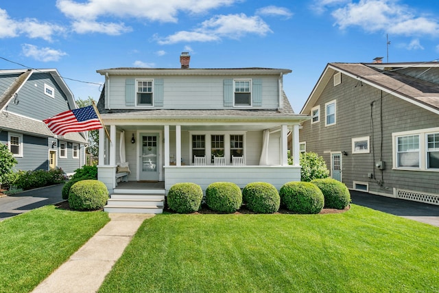 18 Wallace Ave, Norwalk, CT 06855 - view of front facade featuring a porch, a chimney, a front yard, and a shingled roof