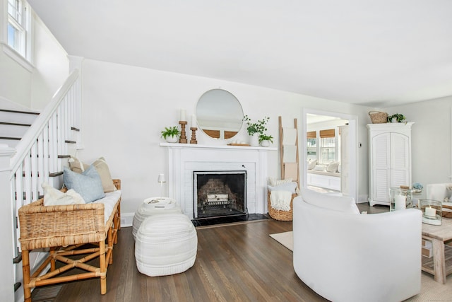 18 Wallace Ave, Norwalk, CT 06855 - living room with wood finished floors, a fireplace, and stairs