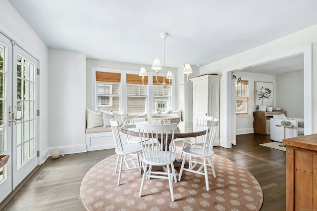 18 Wallace Ave, Norwalk, CT 06855 - dining area with dark wood-style flooring and a chandelier