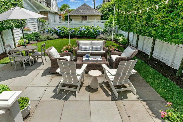 18 Wallace Ave, Norwalk, CT 06855 - fenced backyard with a patio area, an outdoor hangout area, and outdoor dining space