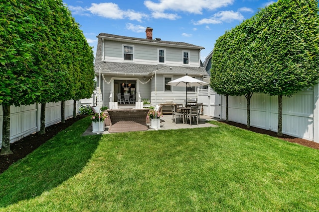 18 Wallace Ave, Norwalk, CT 06855 - back of house featuring a chimney, a fenced backyard, a patio area, and a shingled roof