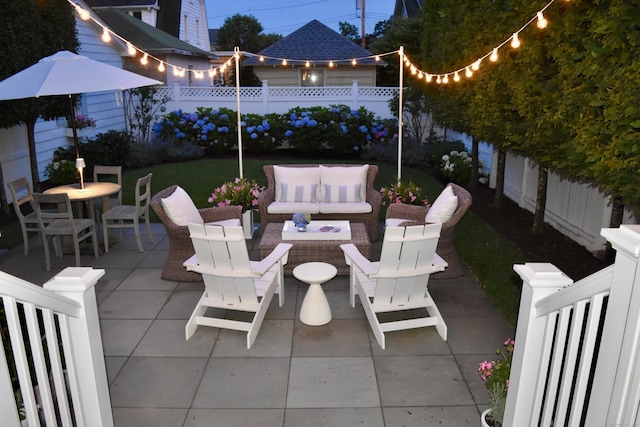 18 Wallace Ave, Norwalk, CT 06855 - fenced backyard featuring a patio and an outdoor living space with a fire pit