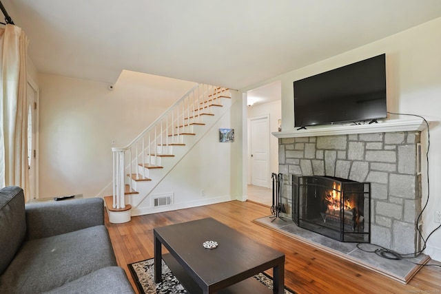 15 Granite Ter, Ansonia, CT 06401 - living room with stairs, a fireplace, and wood finished floors