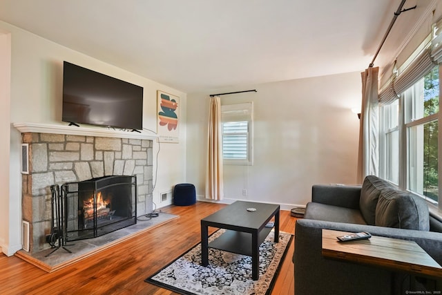 15 Granite Ter, Ansonia, CT 06401 - living room with healthy amount of natural light, a fireplace, and wood finished floors