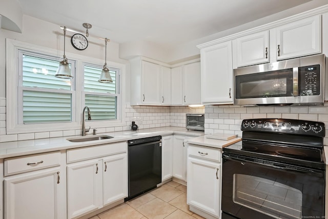 15 Granite Ter, Ansonia, CT 06401 - kitchen featuring black appliances, tasteful backsplash, white cabinetry, light countertops, and decorative light fixtures