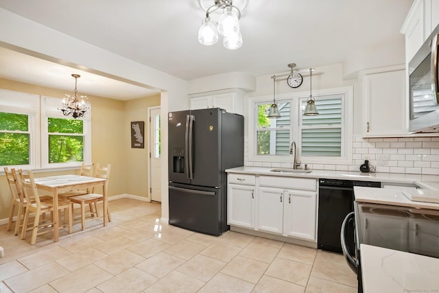 15 Granite Ter, Ansonia, CT 06401 - kitchen with fridge with ice dispenser, a chandelier, black dishwasher, backsplash, and stainless steel microwave