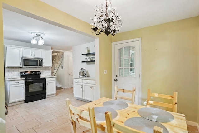 15 Granite Ter, Ansonia, CT 06401 - dining space with light tile patterned flooring and a chandelier