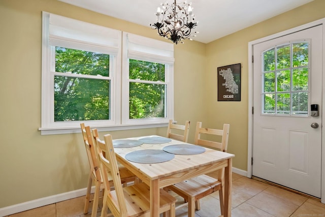 15 Granite Ter, Ansonia, CT 06401 - dining area with light tile patterned floors, a chandelier, and healthy amount of natural light