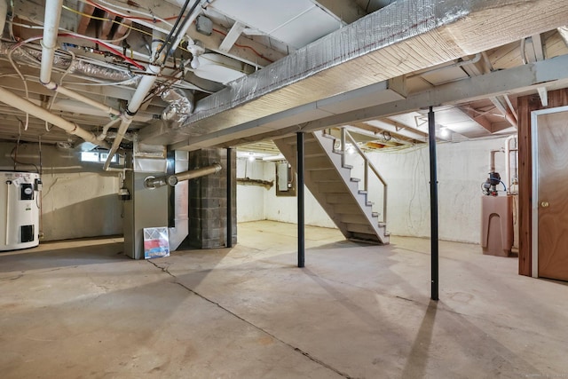 15 Granite Ter, Ansonia, CT 06401 - unfinished below grade area featuring water heater, stairs, heating unit, and a water softener