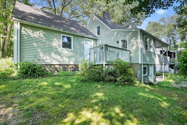 15 Granite Ter, Ansonia, CT 06401 - rear view of property featuring a deck, a lawn, and a chimney