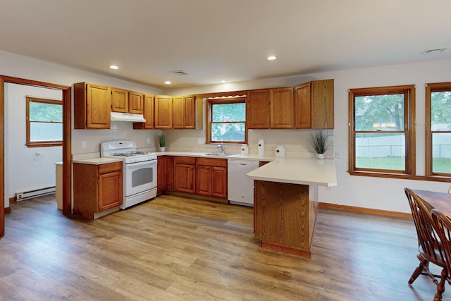20 Hickory St, Danbury, CT 06810 - kitchen with white appliances, under cabinet range hood, a peninsula, light countertops, and a baseboard heating unit