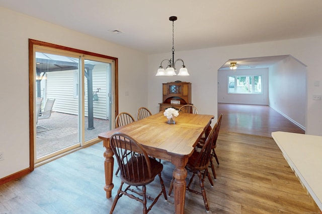 20 Hickory St, Danbury, CT 06810 - dining space featuring light wood-style floors, arched walkways, and a ceiling fan
