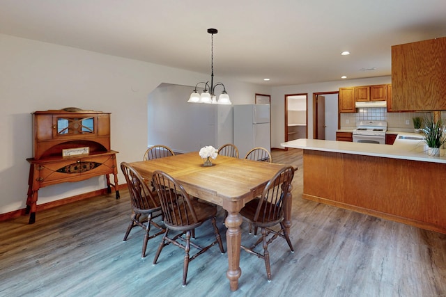 20 Hickory St, Danbury, CT 06810 - dining room with light wood-type flooring, recessed lighting, and a chandelier