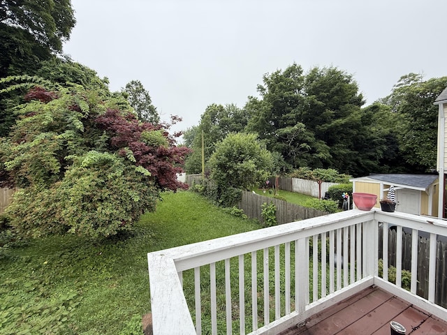 118 Cherry Ann St, New Haven, CT 06514 - wooden deck featuring a storage unit