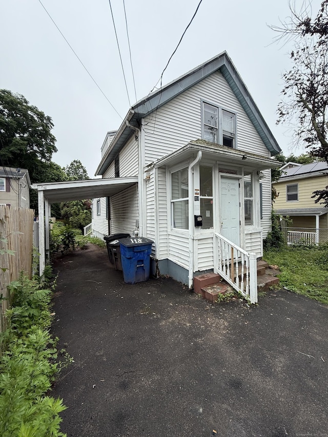 118 Cherry Ann St, New Haven, CT 06514 - view of front of house featuring entry steps, driveway, and a carport