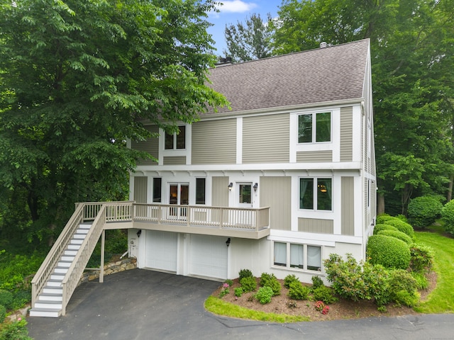 212 Richards Ave Apt 6, Norwalk, CT 06850 - view of front of property featuring a shingled roof, stairway, asphalt driveway, and an attached garage