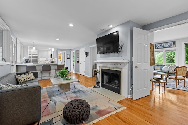 212 Richards Ave Apt 6, Norwalk, CT 06850 - living area featuring light wood-style floors, recessed lighting, and a fireplace