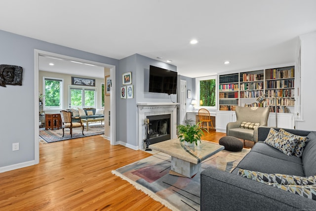 212 Richards Ave Apt 6, Norwalk, CT 06850 - living room featuring light wood-type flooring, recessed lighting, and a tile fireplace