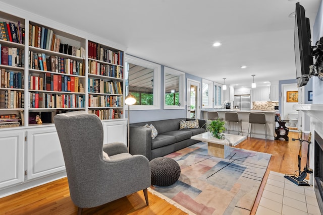 212 Richards Ave Apt 6, Norwalk, CT 06850 - living area with light wood-style floors, recessed lighting, and a fireplace with flush hearth