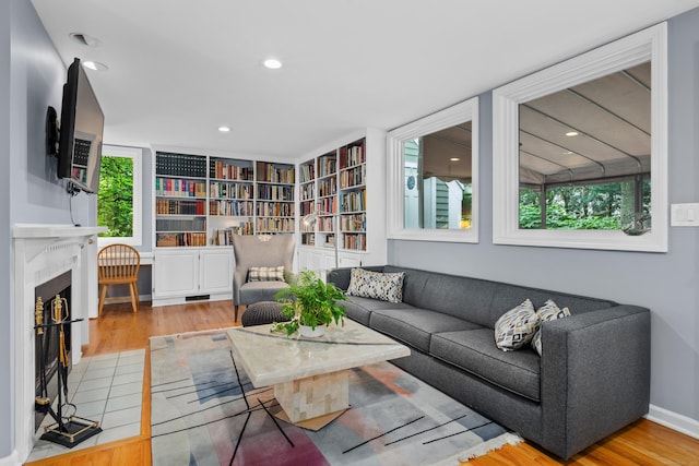 212 Richards Ave Apt 6, Norwalk, CT 06850 - living room featuring plenty of natural light, wood finished floors, a fireplace with flush hearth, and recessed lighting