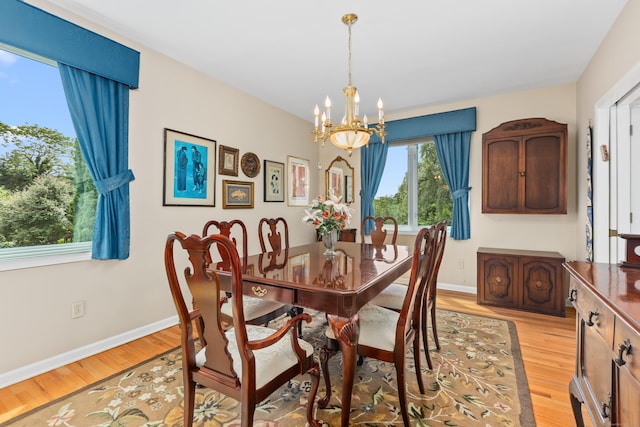 212 Richards Ave Apt 6, Norwalk, CT 06850 - dining room featuring a chandelier and light wood finished floors