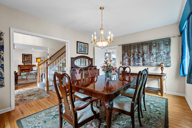212 Richards Ave Apt 6, Norwalk, CT 06850 - dining space with a chandelier, stairway, and light wood finished floors