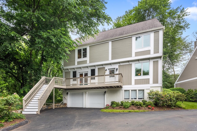212 Richards Ave Apt 6, Norwalk, CT 06850 - view of front of home featuring driveway, stairway, an attached garage, and a shingled roof