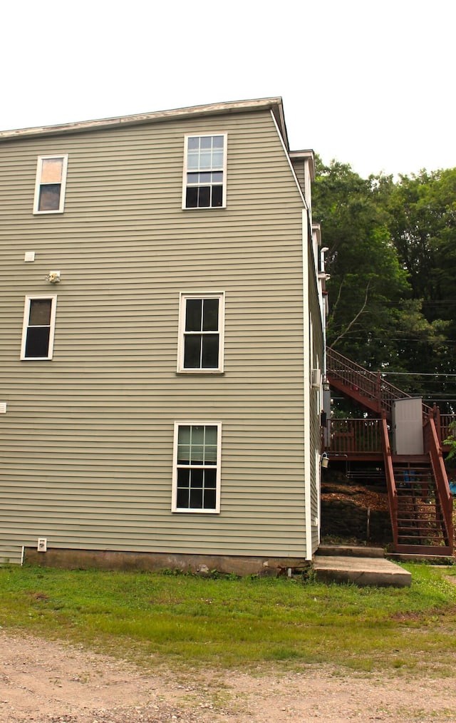 51 Main St, Thompson, CT 06255 - view of side of home featuring stairs