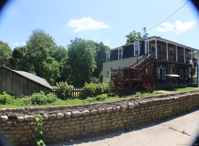 51 Main St, Thompson, CT 06255 - back of house featuring stairway