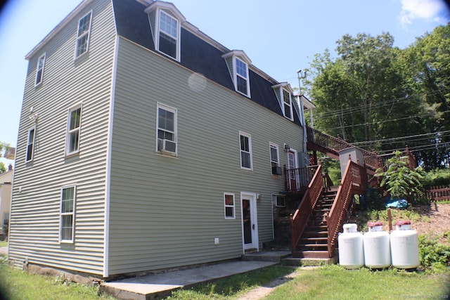 51 Main St, Thompson, CT 06255 - rear view of house with stairs and a wooden deck