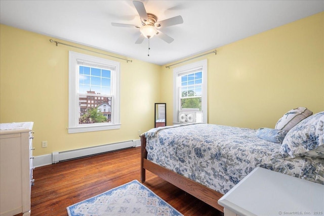 20 Channing St, New London, CT 06320 - bedroom featuring baseboard heating, wood finished floors, and a ceiling fan