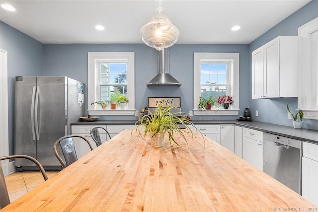 20 Channing St, New London, CT 06320 - kitchen with appliances with stainless steel finishes, wood counters, white cabinets, recessed lighting, and tile patterned flooring