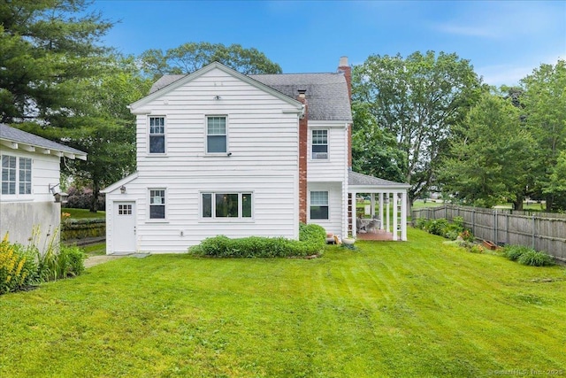 20 Channing St, New London, CT 06320 - back of property with a chimney and a shingled roof