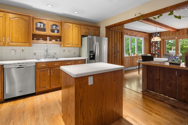 205 Luther Dr, Southbury, CT 06488 - kitchen with appliances with stainless steel finishes, light wood finished floors, brown cabinets, beam ceiling, and recessed lighting