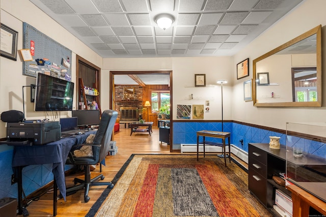 205 Luther Dr, Southbury, CT 06488 - office space featuring wood finished floors, a baseboard radiator, a paneled ceiling, and a wainscoted wall