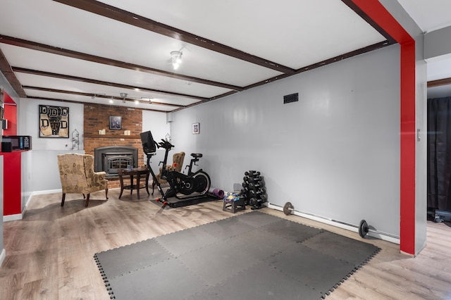 205 Luther Dr, Southbury, CT 06488 - exercise area with wood finished floors and baseboards